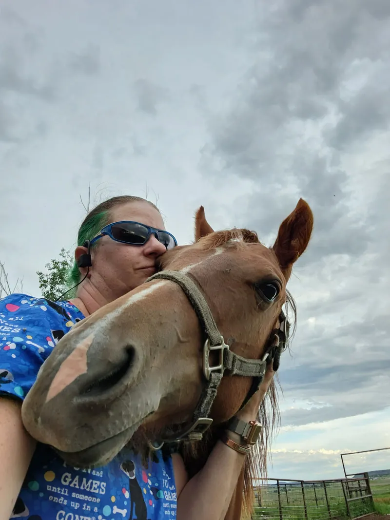 A Bayfield Animal Hospital team member with a horse